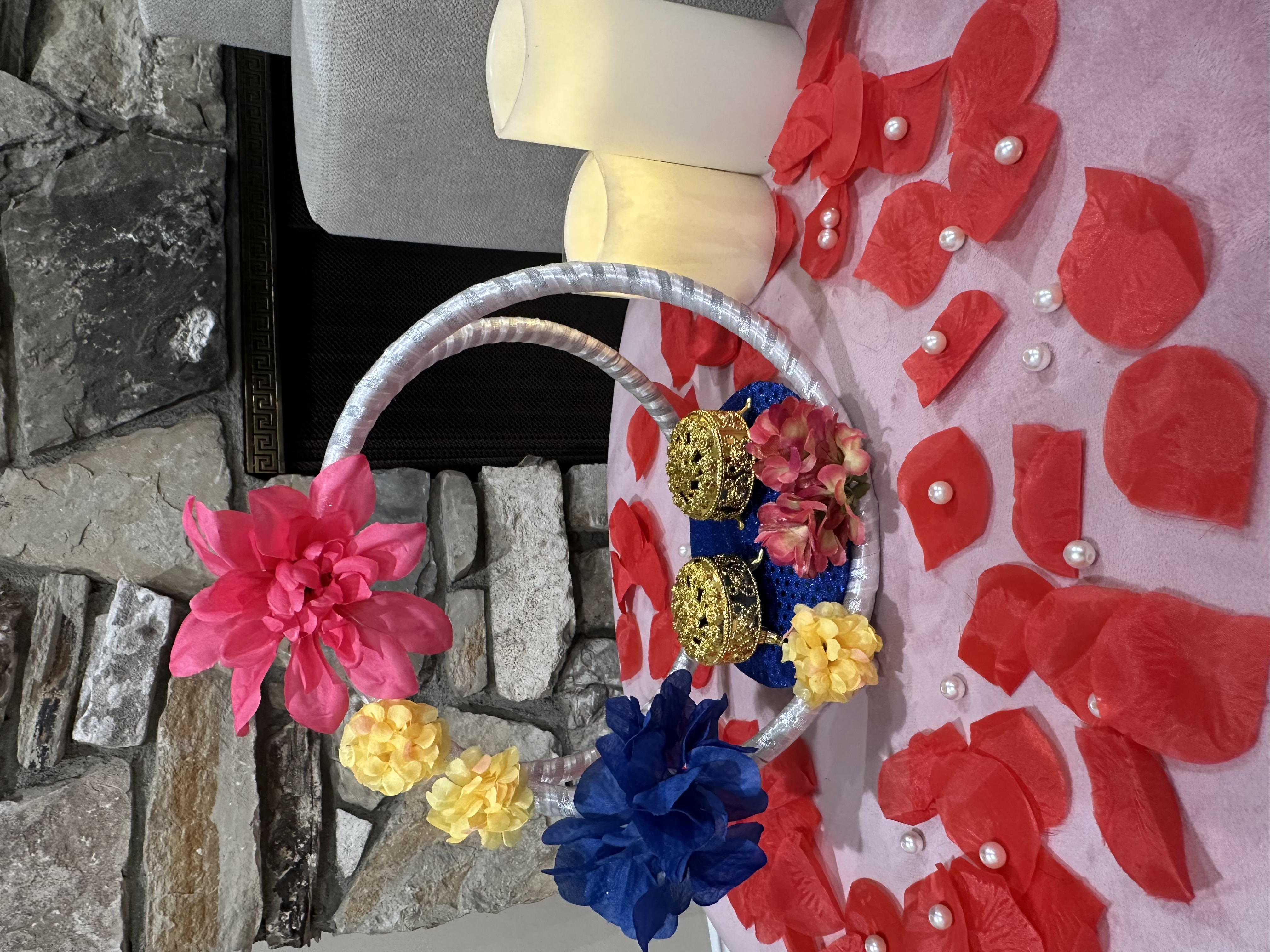Decorative wedding basket with flowers, candles, and rose petals